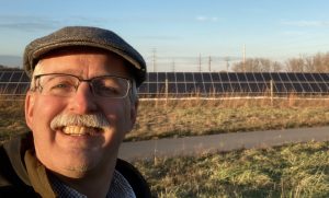Man in front of solar facility in MN 